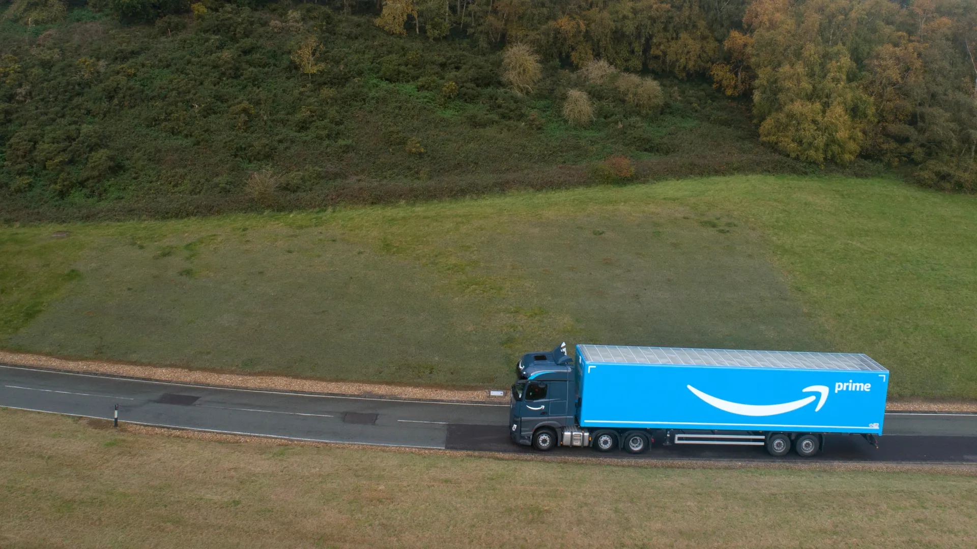 Amazon Freight Partners truck driving along a European highway delivering freight